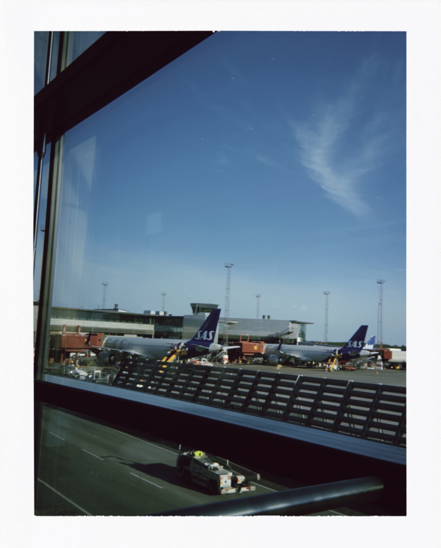 An airport seen through a window.